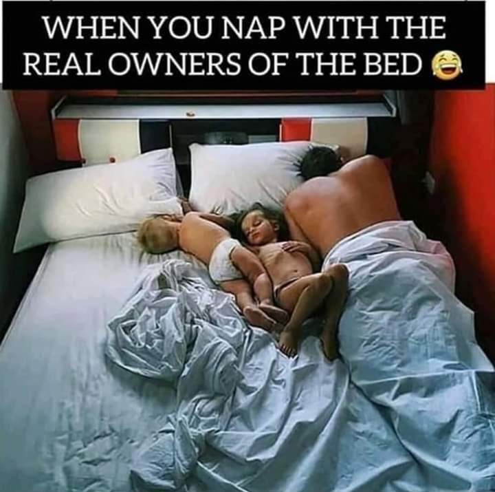 Dads and kids sleeping on the bed